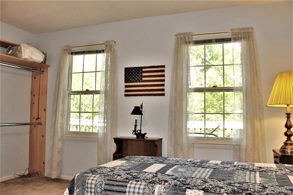 185 Davis Creek Road Murphy, NC 28906 - Photo 20 of 48 a bedroom with a bed and a window