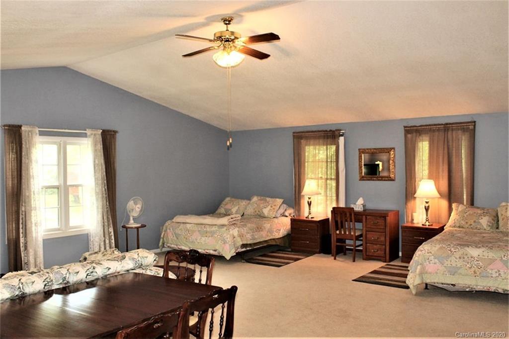 185 Davis Creek Road Murphy, NC 28906 - Photo 23 of 48 a bedroom with furniture and window