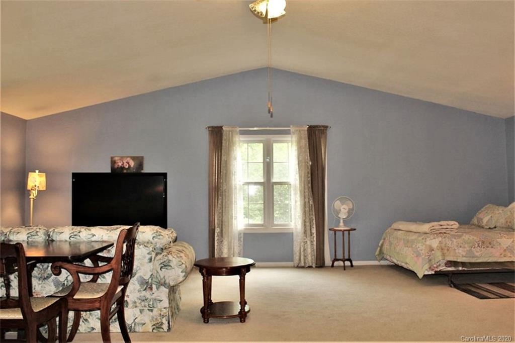 185 Davis Creek Road Murphy, NC 28906 - Photo 25 of 48 a bedroom with bed and window