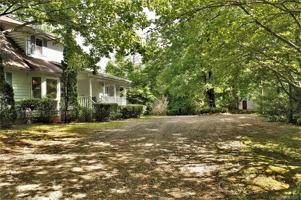 185 Davis Creek Road Murphy, NC 28906 - Photo 5 of 48 a view of a yard in front of a house with a large tree