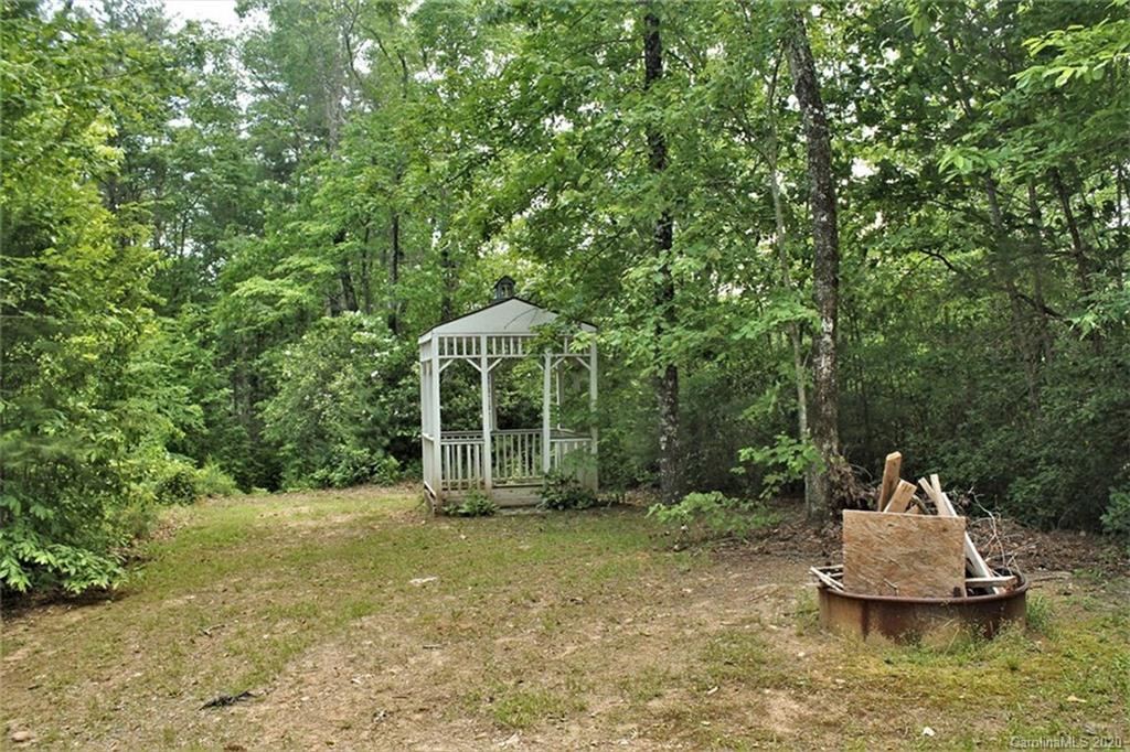 185 Davis Creek Road Murphy, NC 28906 - Photo 7 of 48 a view of a house with a yard and sitting area