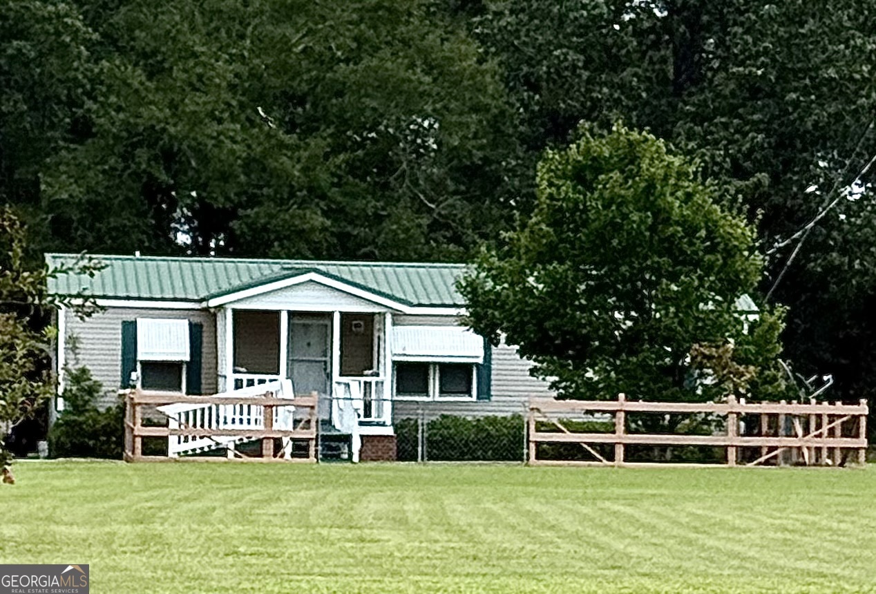 4155 Gamble Mill Road Avera, GA 30803 - Photo 1 of 1 a front view of a house with a yard