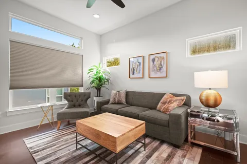 a living room with furniture and a rug