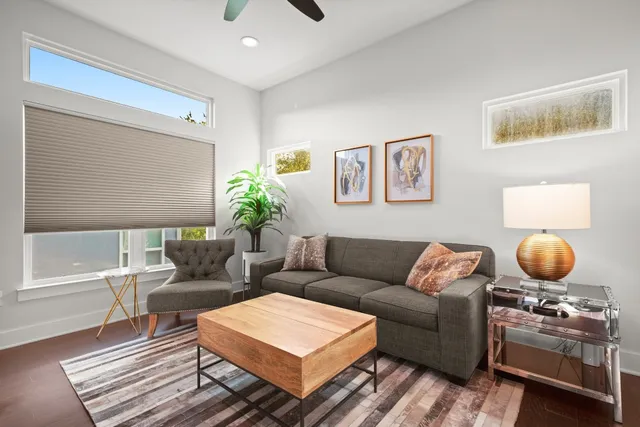a living room with furniture and a rug