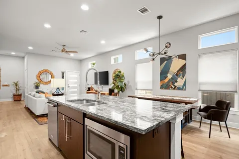 a kitchen with a table and chairs