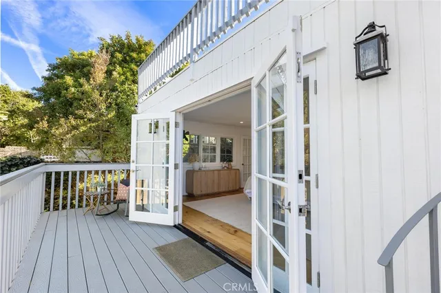 a view of balcony with couch and wooden floor