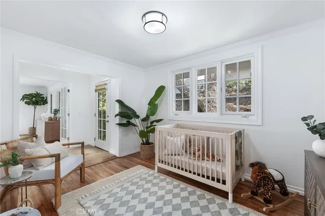 a bedroom with furniture and a window