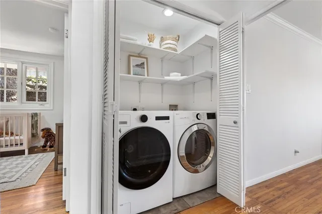 a view of a hallway with washer and dryer