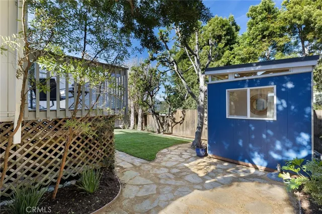 a view of a yard with a large tree