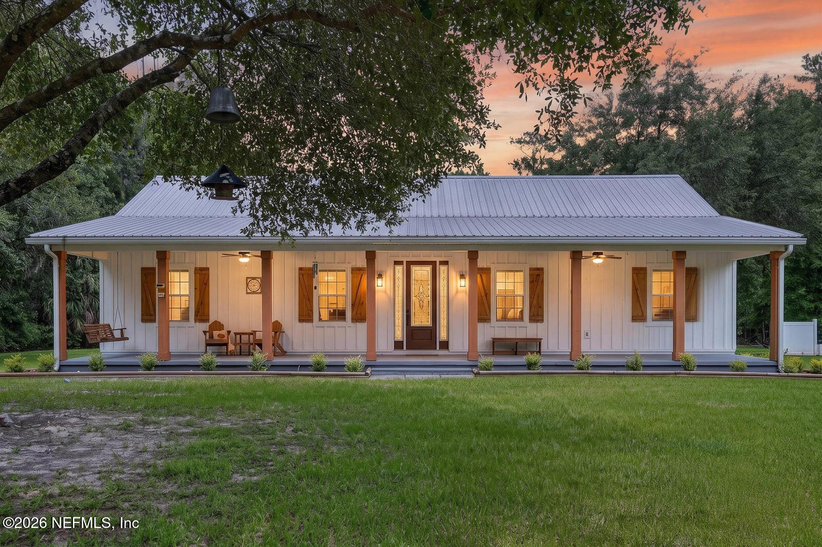 264 Peniel Church Road Palatka, FL 32177 - Photo 1 of 48 a front view of a house with a yard table and chairs