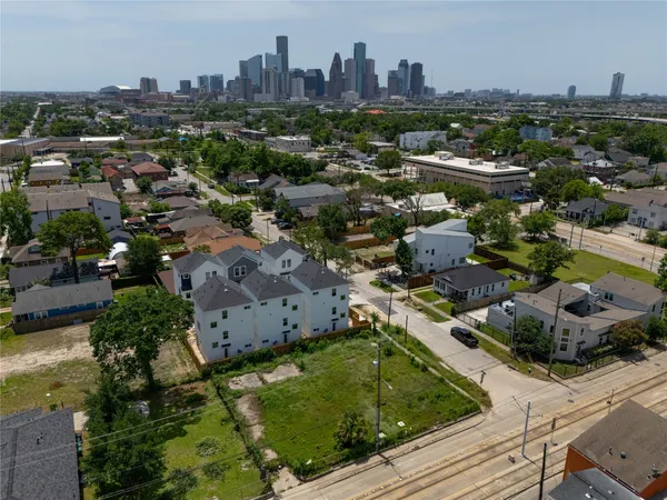 an aerial view of residential houses with outdoor space