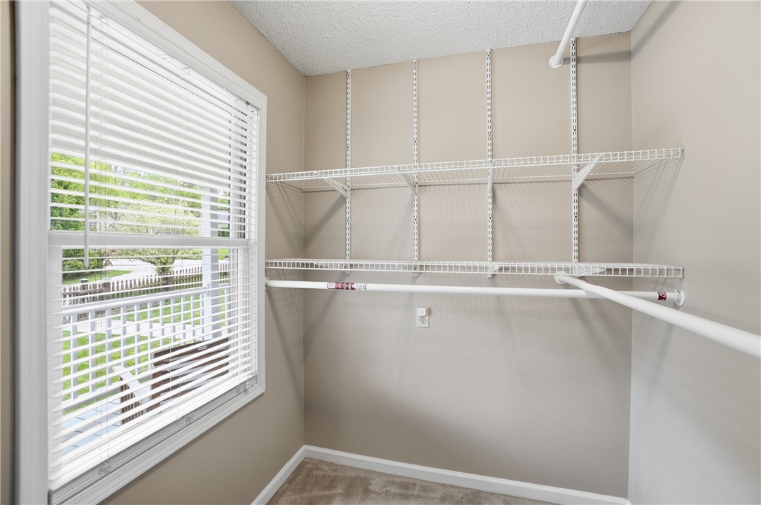 1208 Jarva Lane Springboro, OH 45066 - Photo 39 of 75 This spacious closet features ample shelving and a window, offering both storage and natural light.