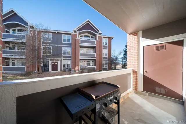 a dinning table sitting in a kitchen next to a large window