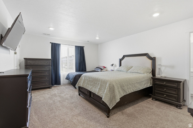 3808 Galatia Road Magna, UT 84044 - Photo 20 of 59 Carpeted room with recessed lighting and a window featuring dark curtains