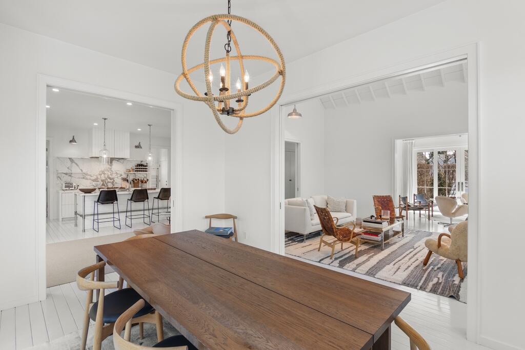 17 Meridian Road Rowayton, CT 06853 - Photo 13 of 40 a view of a dining room with furniture a chandelier and wooden floor