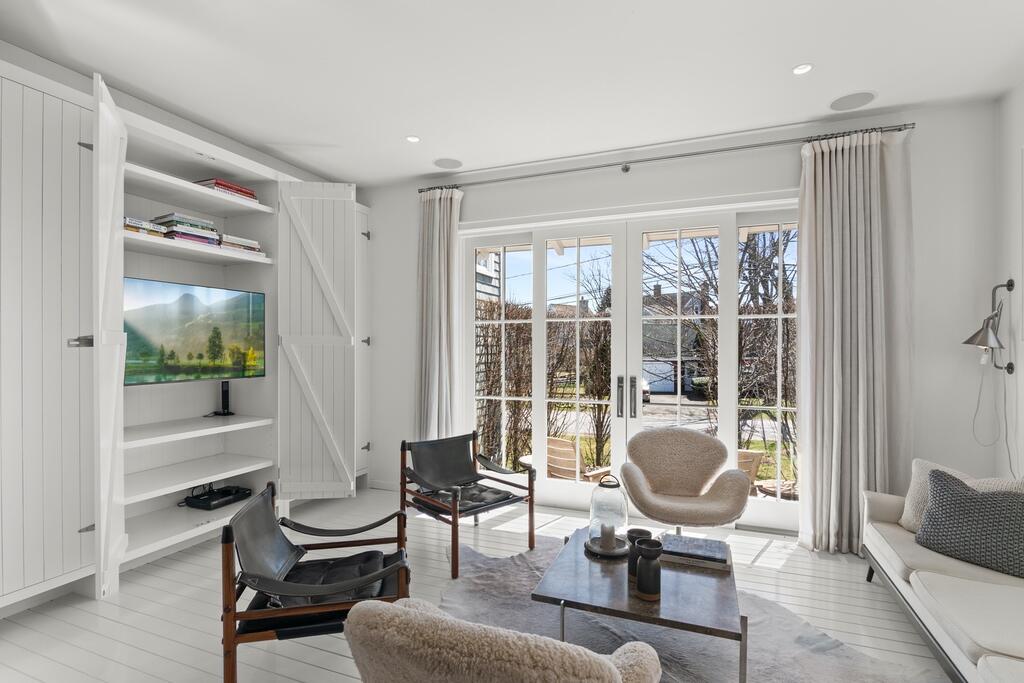 17 Meridian Road Rowayton, CT 06853 - Photo 16 of 40 a living room with furniture and a floor to ceiling window