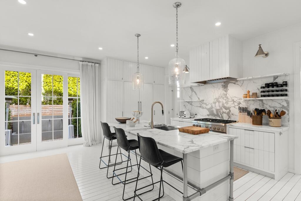17 Meridian Road Rowayton, CT 06853 - Photo 2 of 40 a kitchen with stainless steel appliances kitchen island a large island in the center