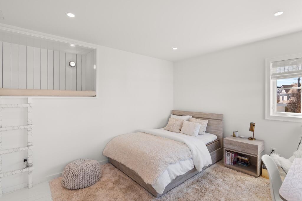 17 Meridian Road Rowayton, CT 06853 - Photo 23 of 40 a bedroom with a bed and a chair