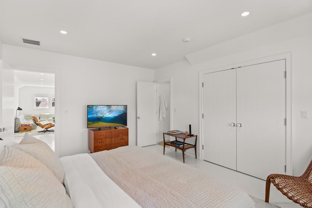 17 Meridian Road Rowayton, CT 06853 - Photo 25 of 40 a bedroom with furniture and a bed