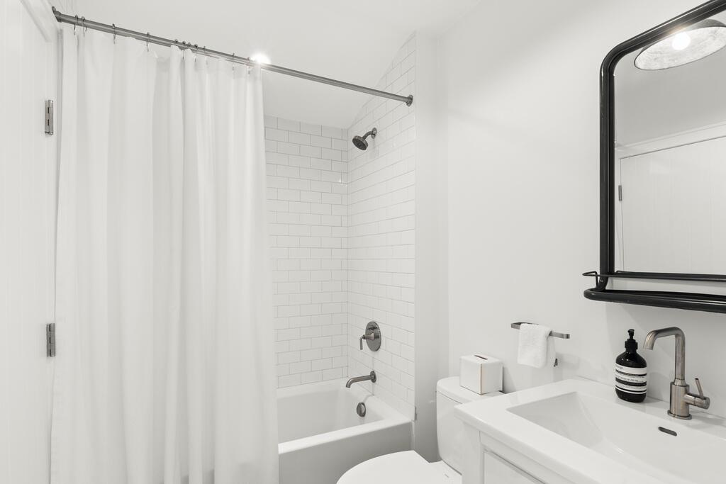 17 Meridian Road Rowayton, CT 06853 - Photo 26 of 40 a bathroom with a sink a toilet and shower