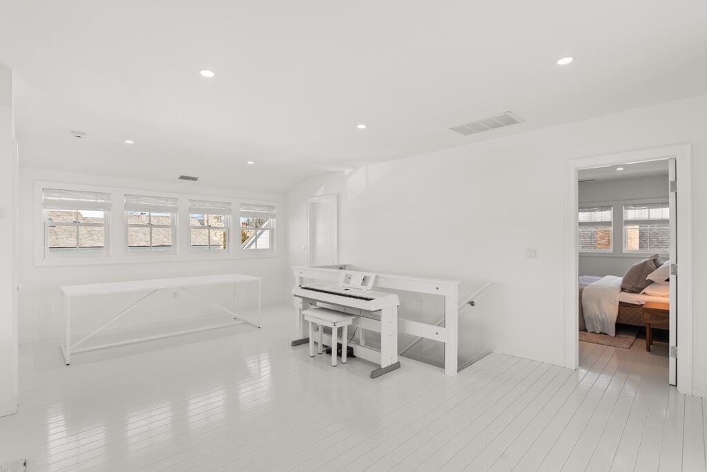 17 Meridian Road Rowayton, CT 06853 - Photo 30 of 40 a room with a chair and white walls