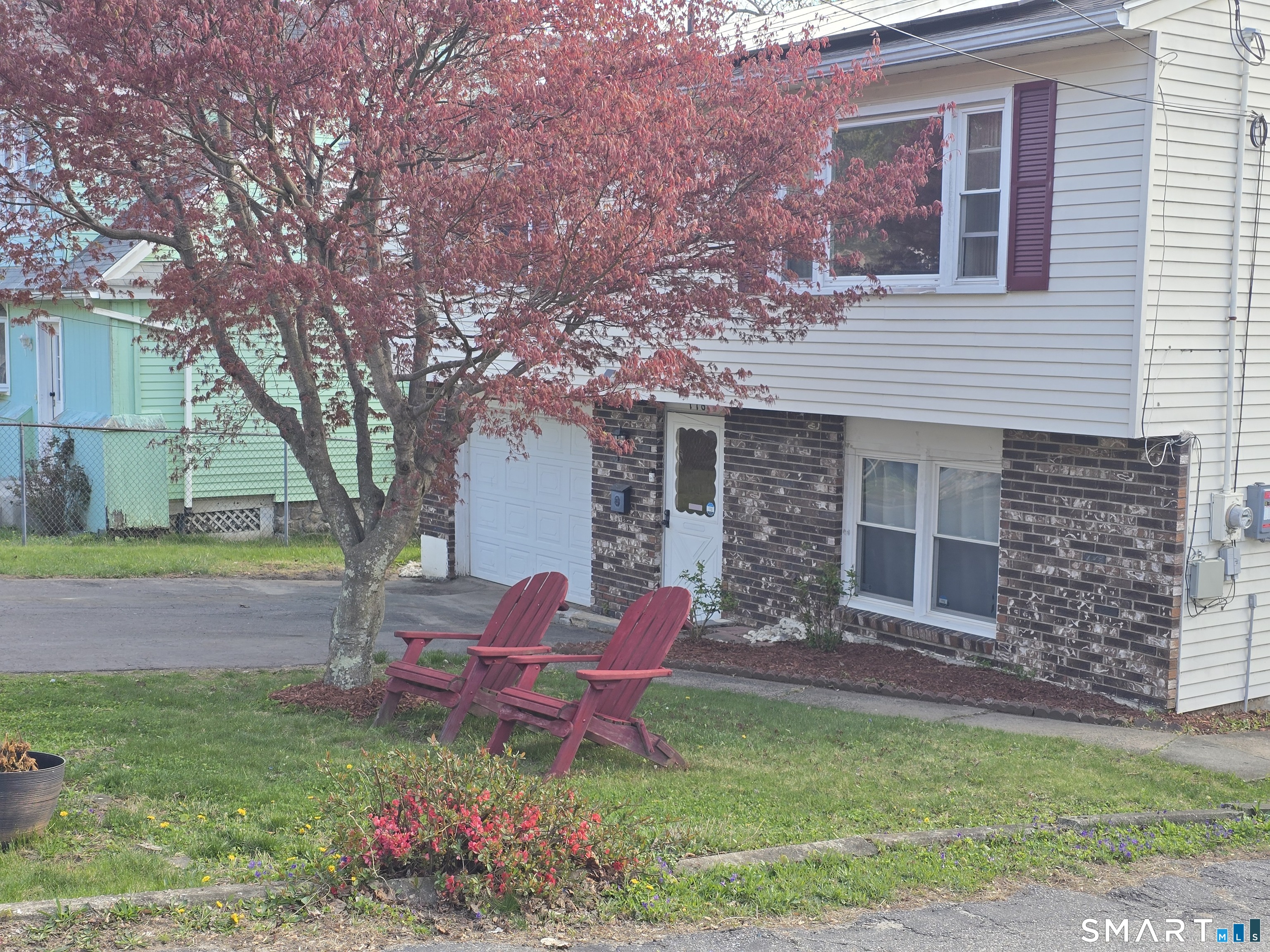 118 Norton Street Waterbury, CT 06708 - Photo 4 of 12 a view of a house with backyard and sitting area