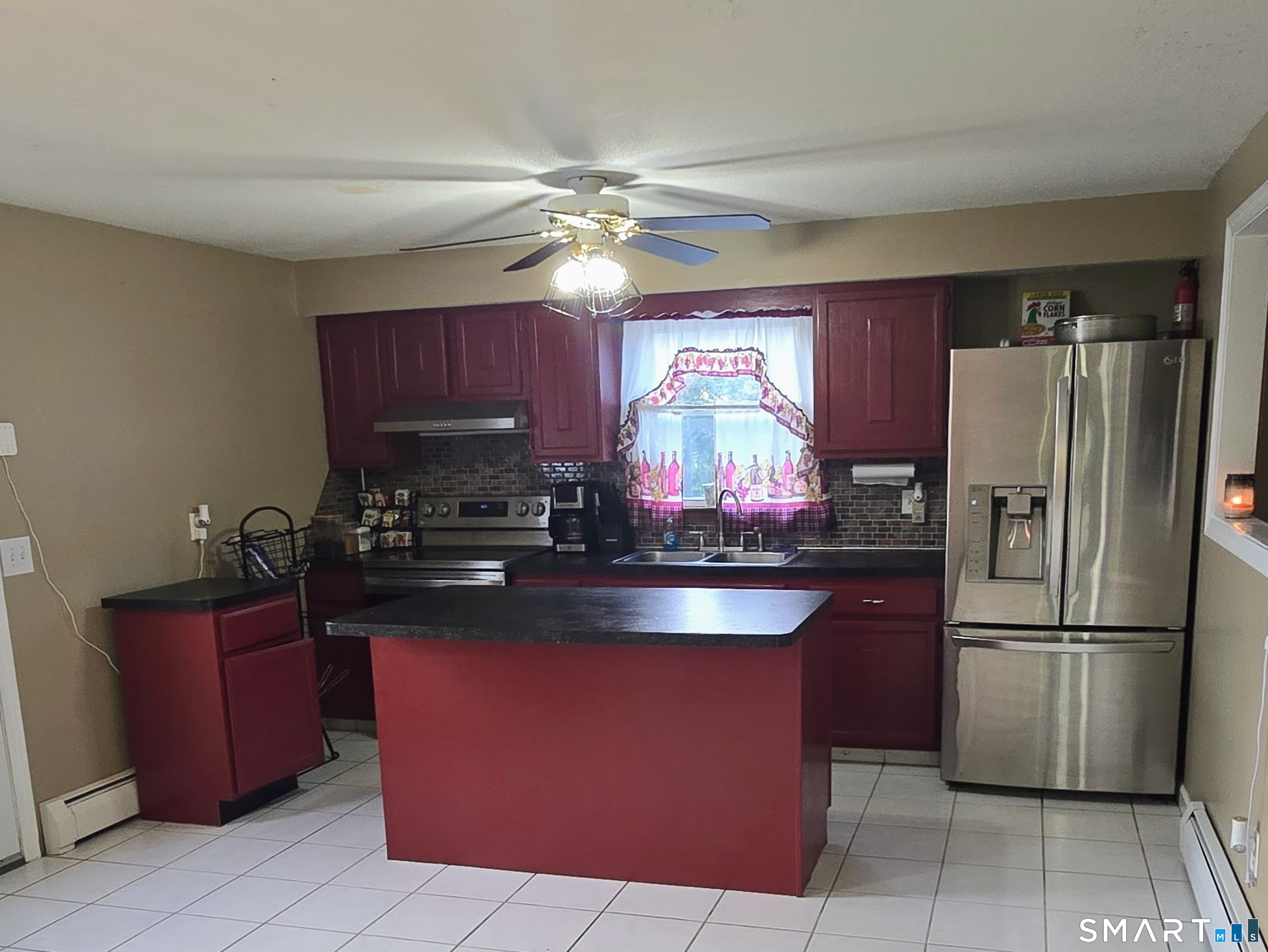118 Norton Street Waterbury, CT 06708 - Photo 6 of 12 a kitchen with granite countertop a refrigerator a stove top oven a sink and dishwasher