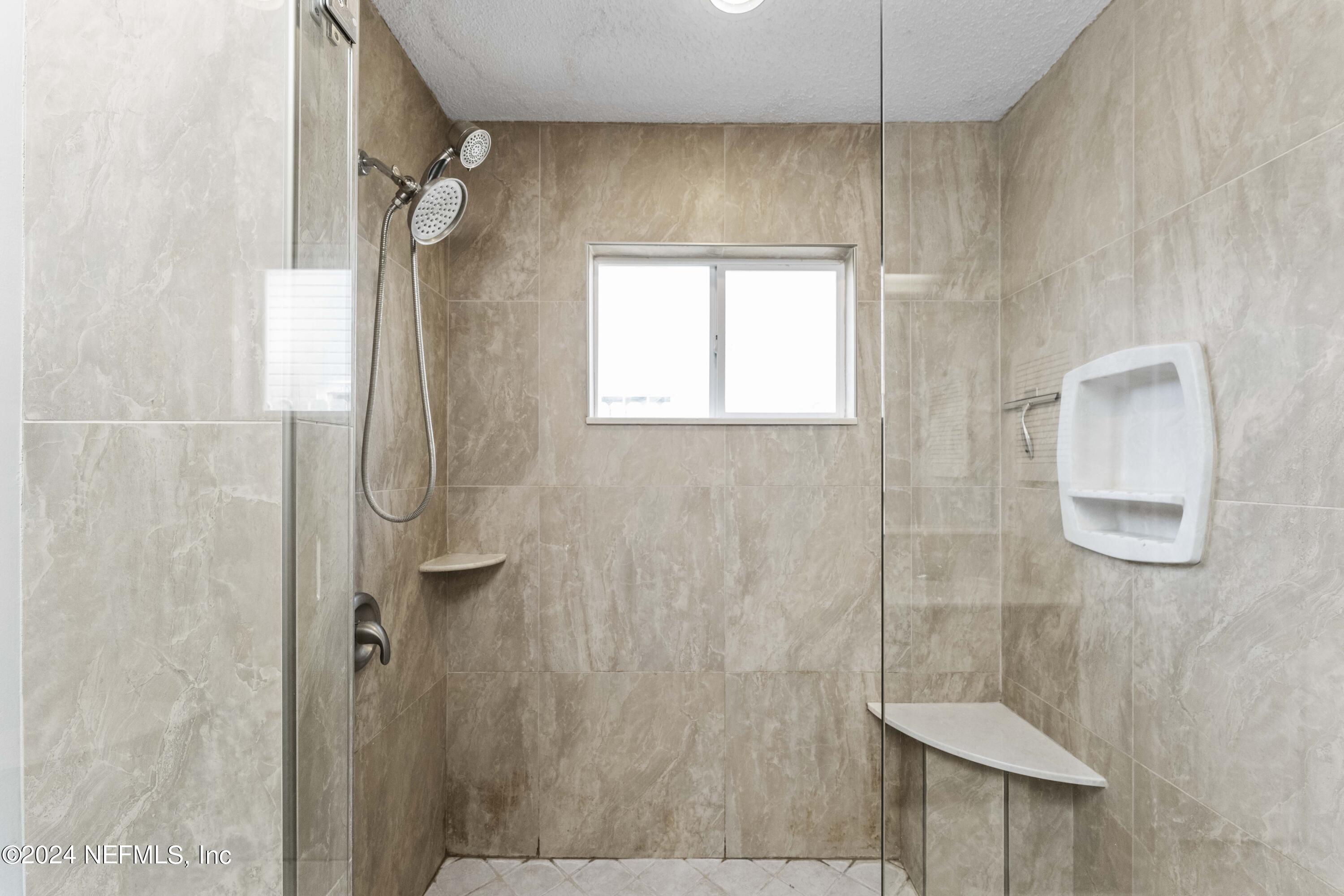 8808 Goodbys Trace Drive Jacksonville, FL 32217 - Photo 15 of 25 a bathroom with a shower and a sink