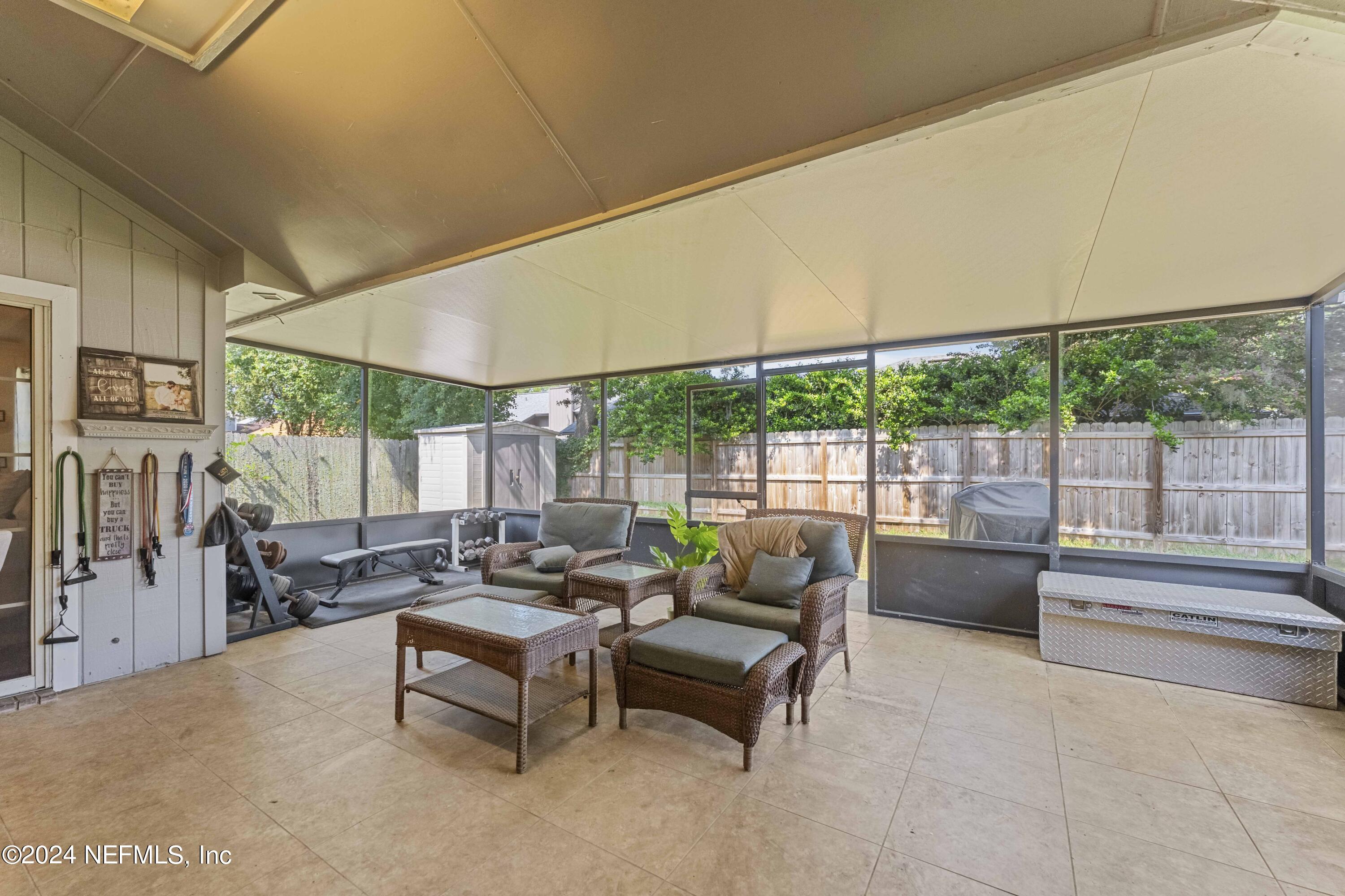 8808 Goodbys Trace Drive Jacksonville, FL 32217 - Photo 19 of 25 a outdoor space with patio the couches and a dining table with garden view