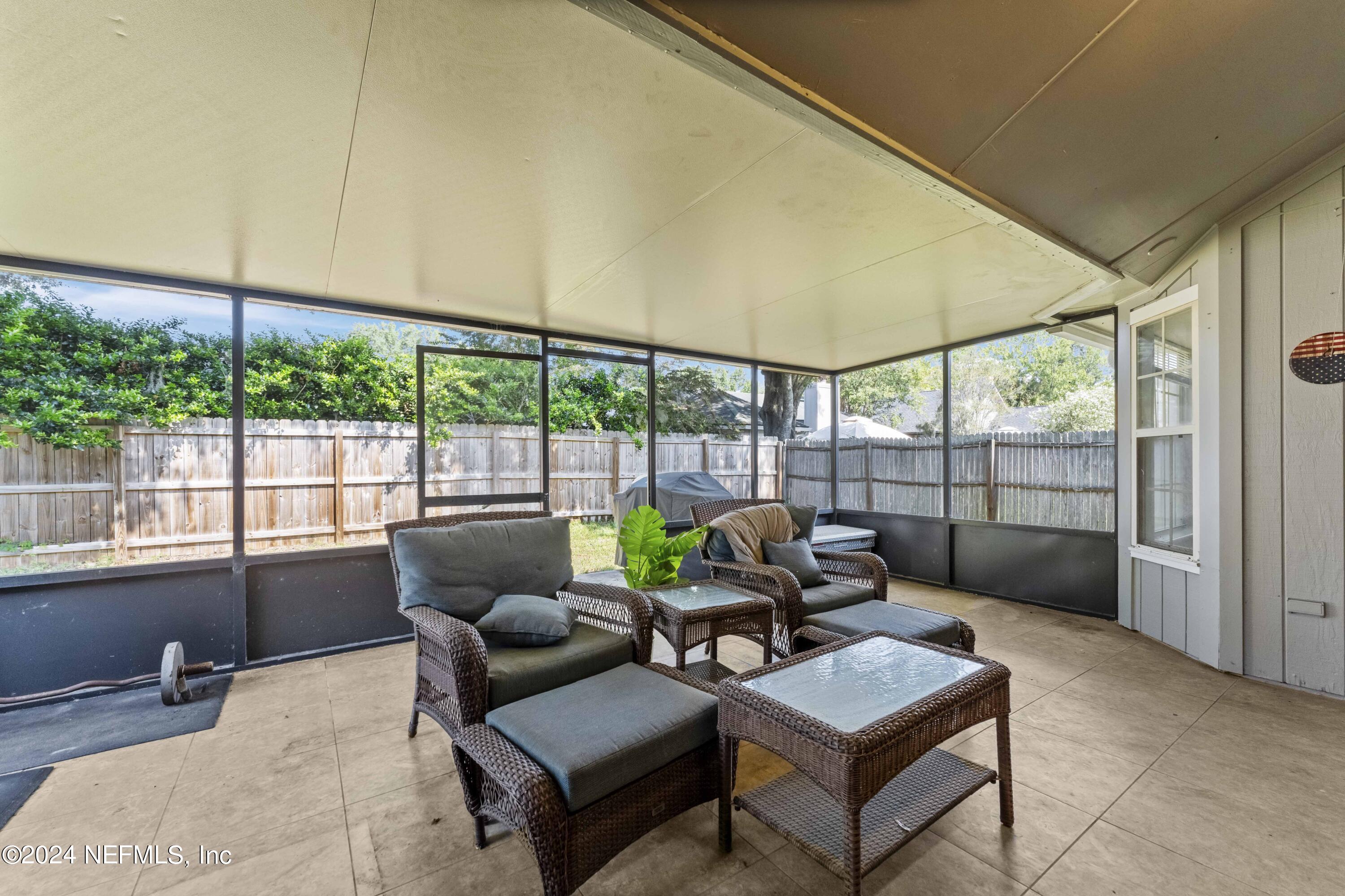 8808 Goodbys Trace Drive Jacksonville, FL 32217 - Photo 20 of 25 a living room with furniture and a yard