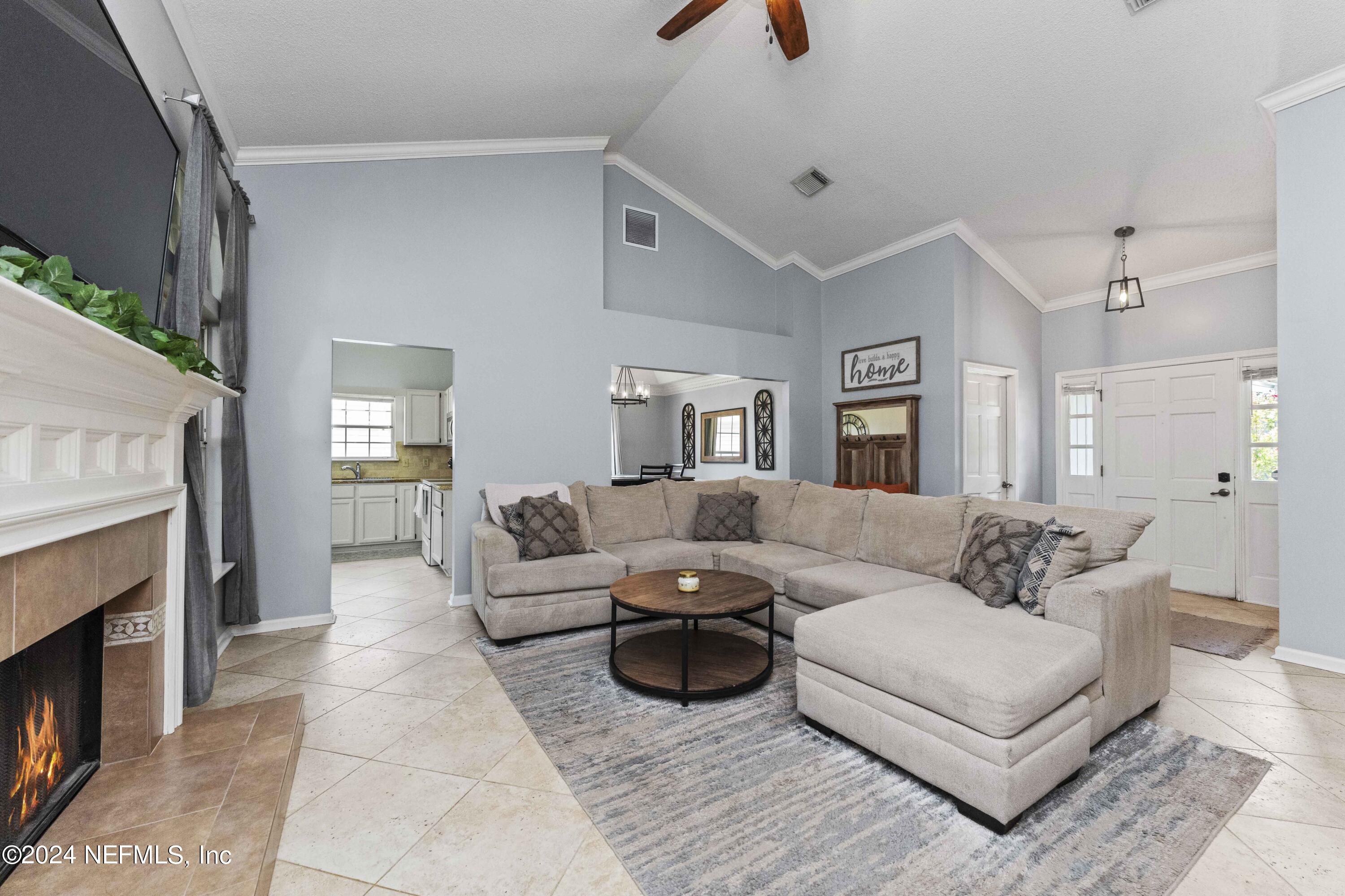 8808 Goodbys Trace Drive Jacksonville, FL 32217 - Photo 4 of 25 a living room with furniture and a fireplace