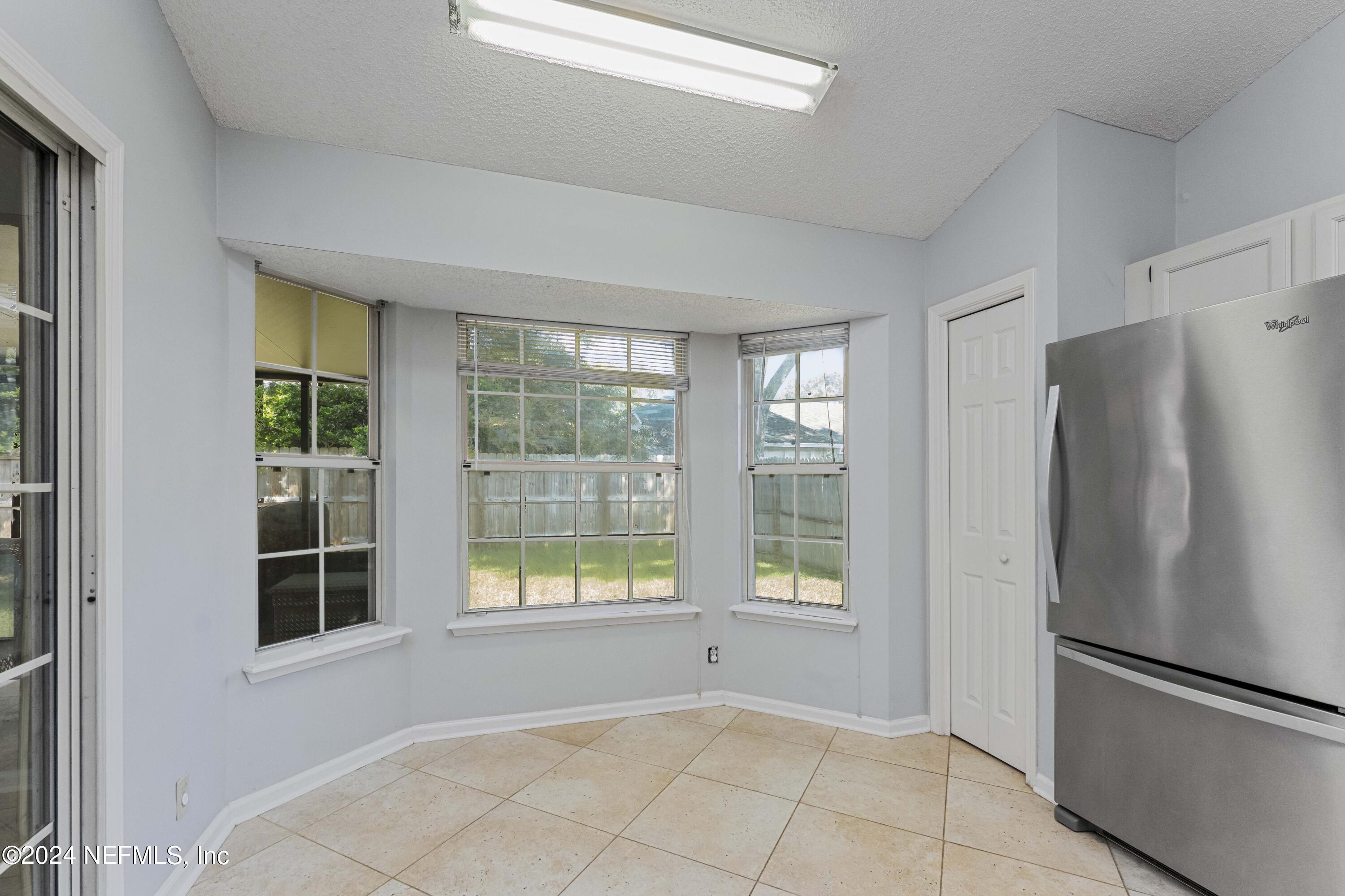8808 Goodbys Trace Drive Jacksonville, FL 32217 - Photo 9 of 25 a view of an empty room with a window