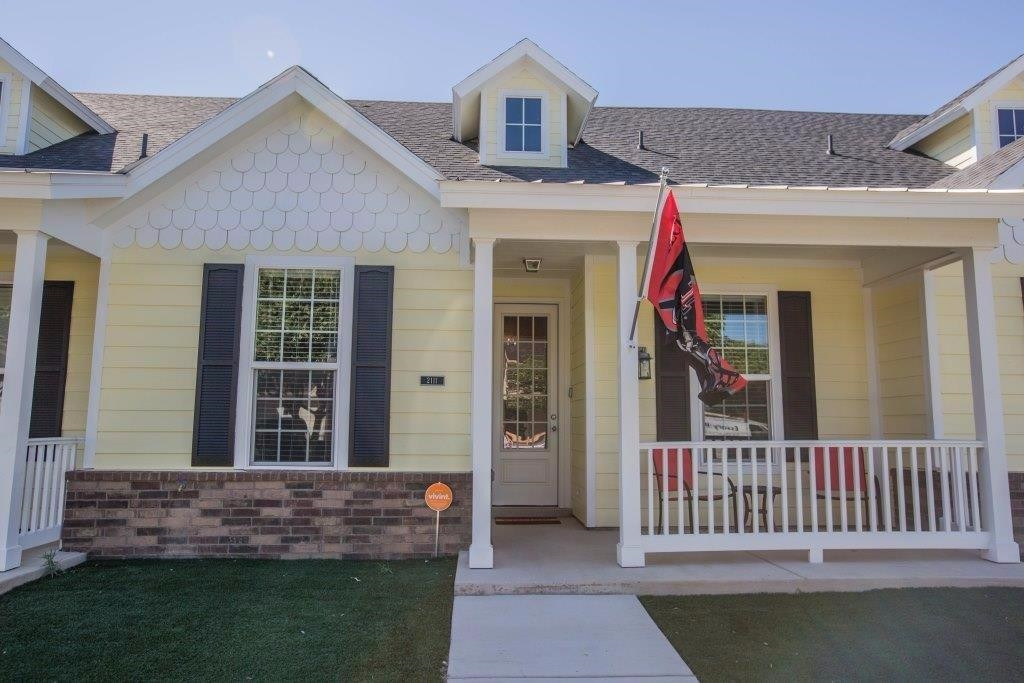 a front view of a house with a porch