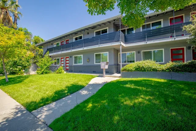 a front view of house with yard and green space
