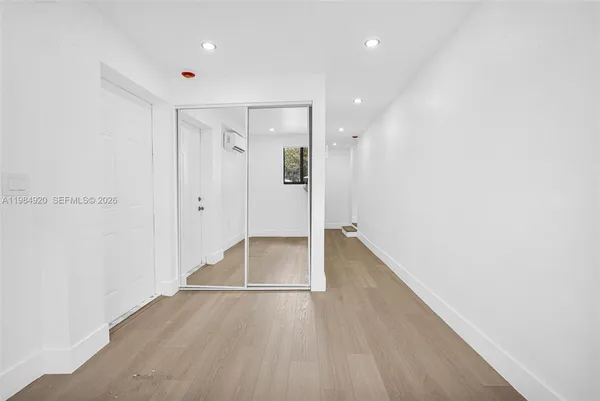 a view of a kitchen from the hallway