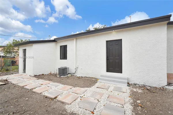 a backyard of a house with garage