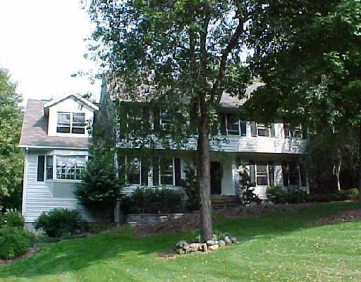 46 Gelding Hill Road Newtown, CT 06482 - Photo 1 of 1 a front view of a house with garden and porch