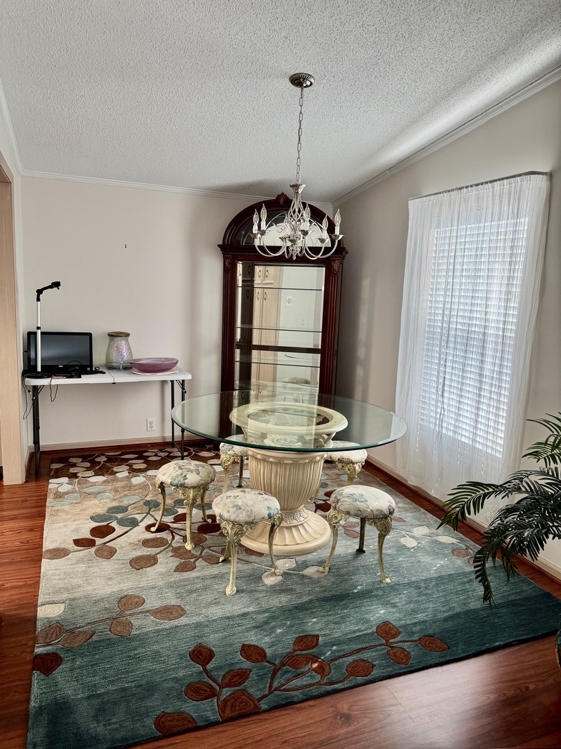 265 Tulip Circle Matteson, IL 60443 - Photo 11 of 25 a room with kitchen island stainless steel appliances a stove a sink and a chandelier