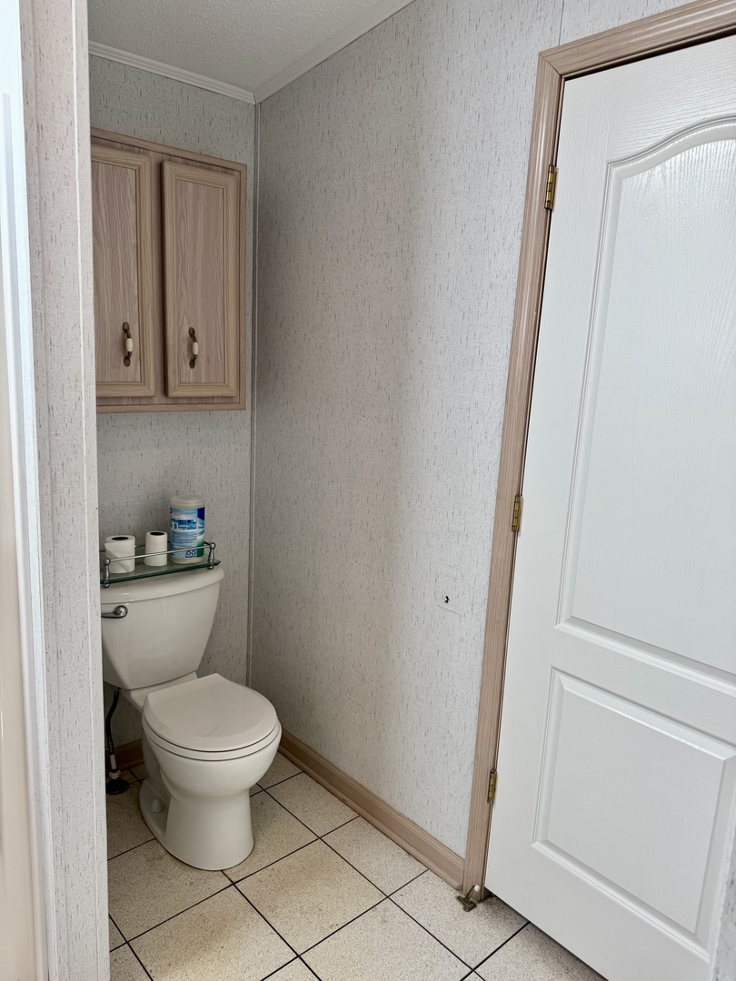 265 Tulip Circle Matteson, IL 60443 - Photo 15 of 25 a white toilet sitting next to a bathroom sink