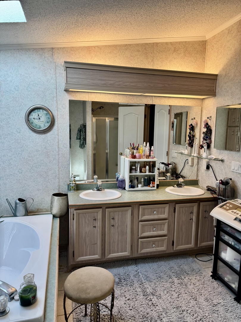 265 Tulip Circle Matteson, IL 60443 - Photo 20 of 25 a spacious bathroom with a double vanity sink and a mirror