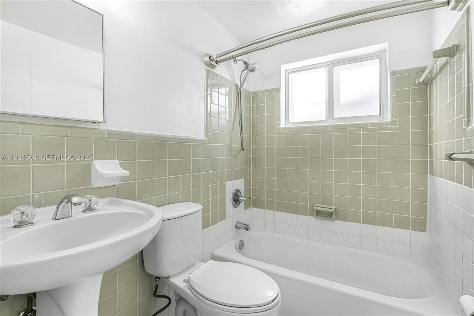 1850 Meridian Avenue, Unit 12 Miami Beach, FL 33139 - Photo 9 of 20 a bathroom with a sink toilet and shower