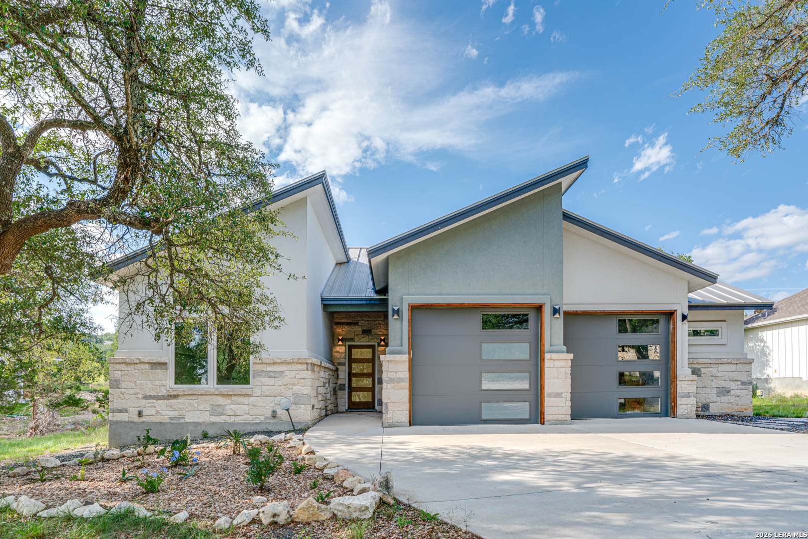 a front view of a house with a garage