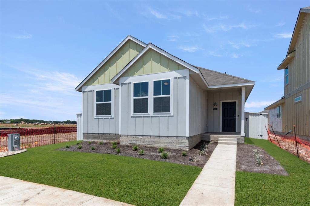 View of front facade with board and batten siding