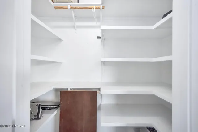 a view of a patio with a table and chairs