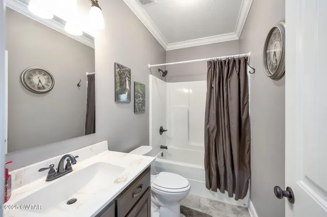 a backyard of a house with barbeque oven table and chairs