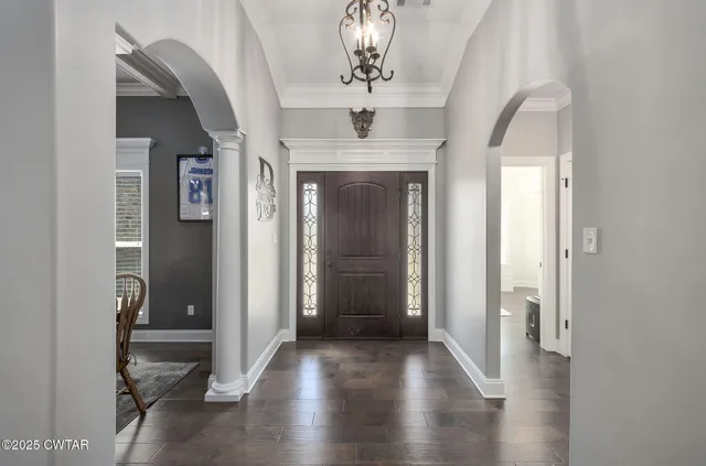 a view of a hallway to a livingroom and a couch
