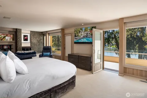 a bed room with a bed and a television