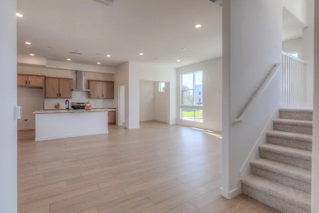 a kitchen with a sink stove and cabinets