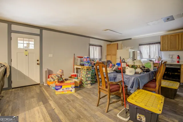 a view of a dining room with furniture and a window