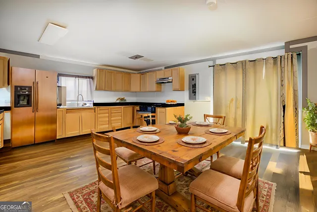 a kitchen with a refrigerator and a sink